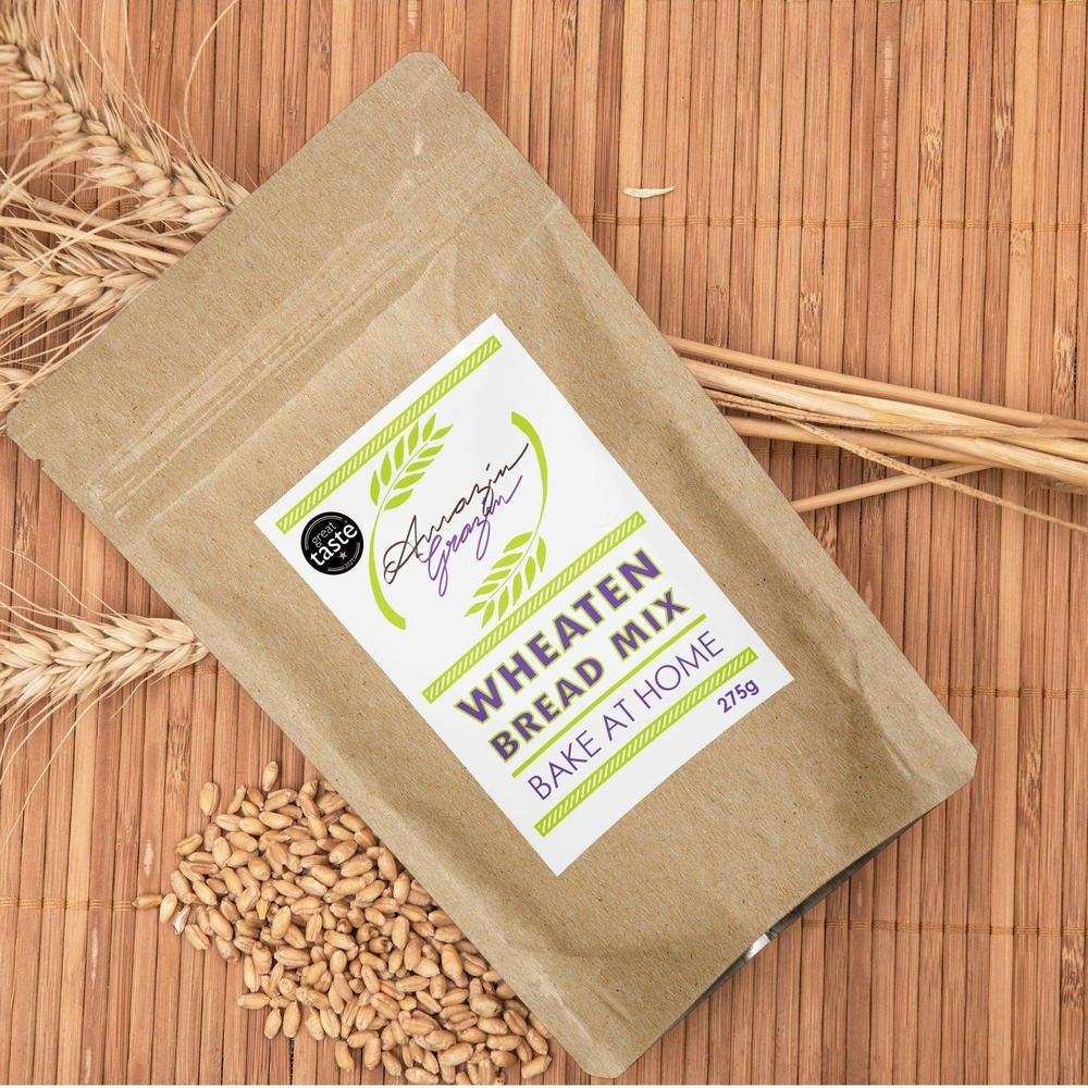 Amazin Grazin Wheaten Bread Mix bake at home kit with grain on wooden background