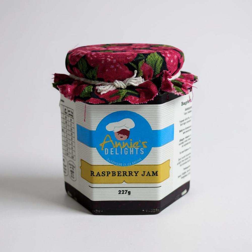 Annie's Delights Raspberry Jam 227g jar with floral fabric cover and label showing natural Irish raspberry jam
