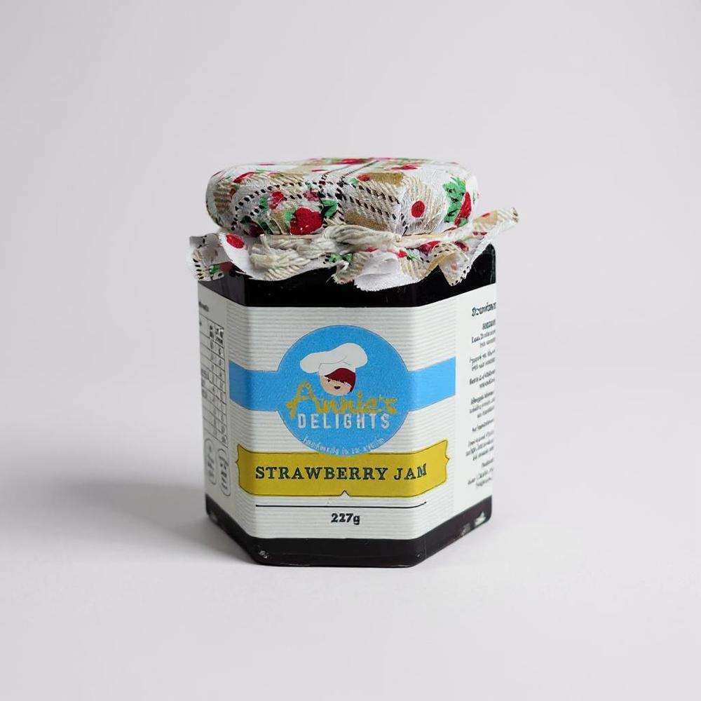 Annie's Delights Strawberry Jam jar with floral fabric cover, handmade from locally grown strawberries in Northern Ireland
