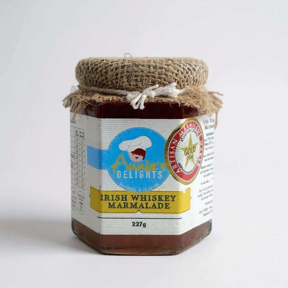 Jar of Annie's Delights Whiskey Marmalade with burlap cover and award label
