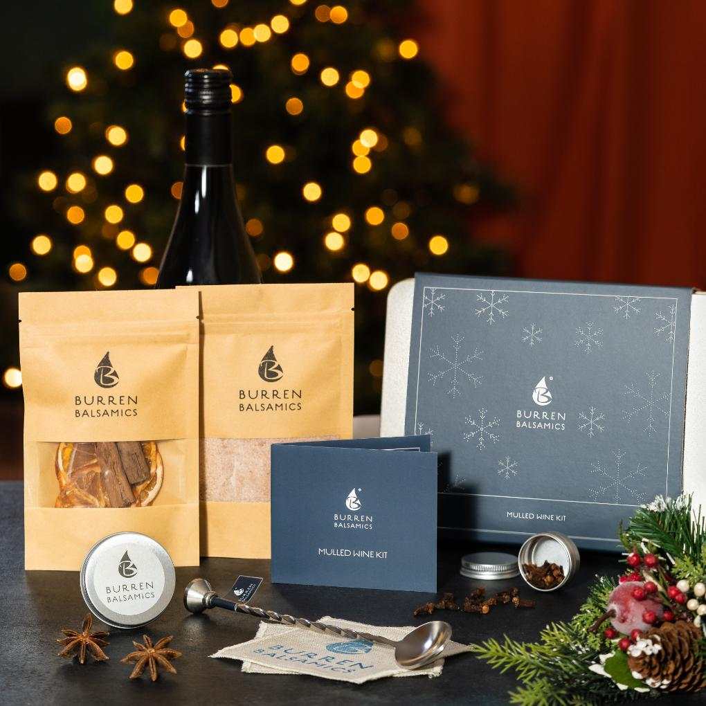 Burren Balsamics Mulled Wine Kit with spiced sugar, dried fruit, star anise, cloves, coasters, and mixing spoon for making mulled wine