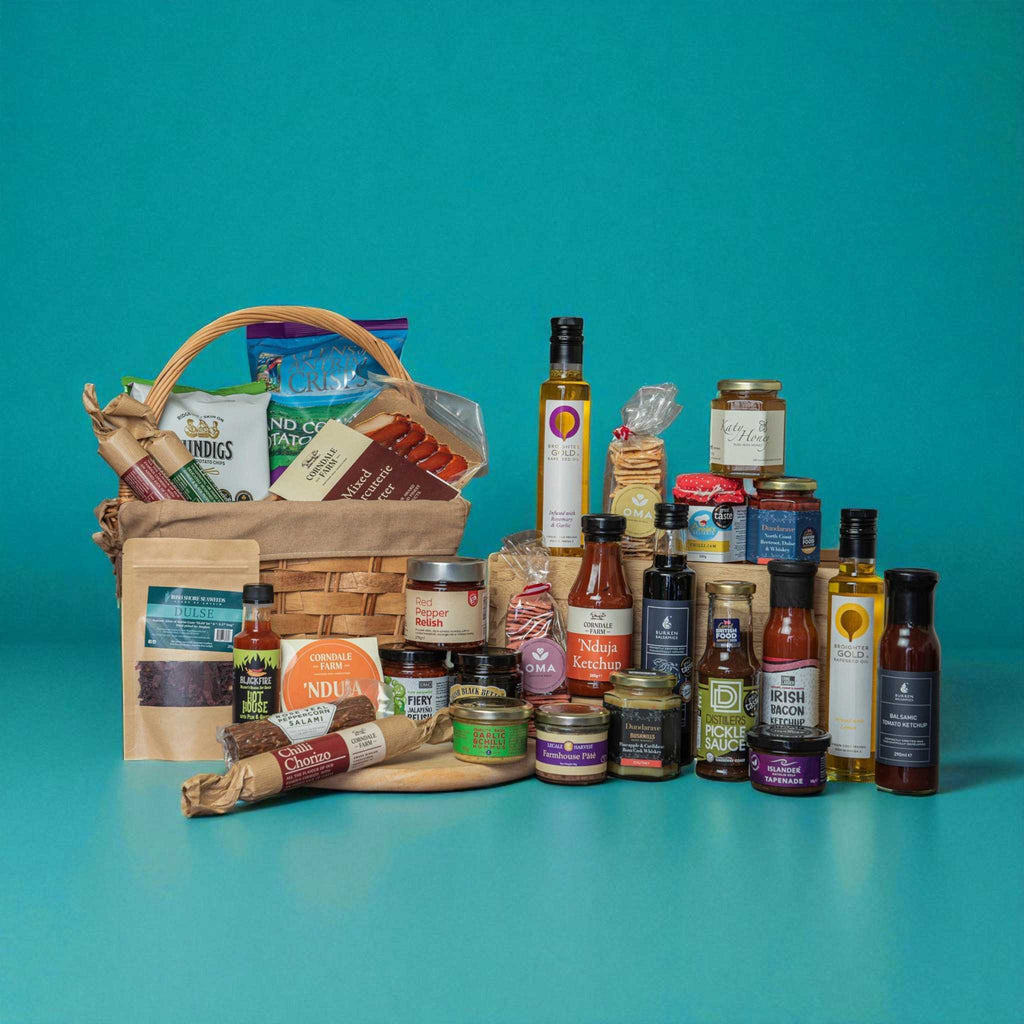 Northern Ireland charcuterie gifting box with artisanal meats, pâtés, crisps, sauces, honey, and dips in wicker hamper