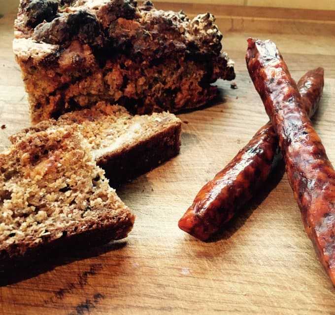 Corndale Farm Chorizo spicy beer sticks with rustic bread on wooden board