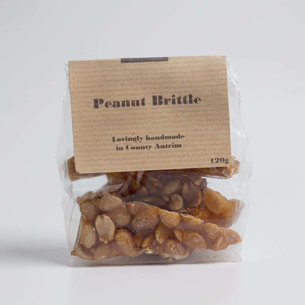 Delish Peanut Brittle crunchy toffee with peanuts in clear packaging