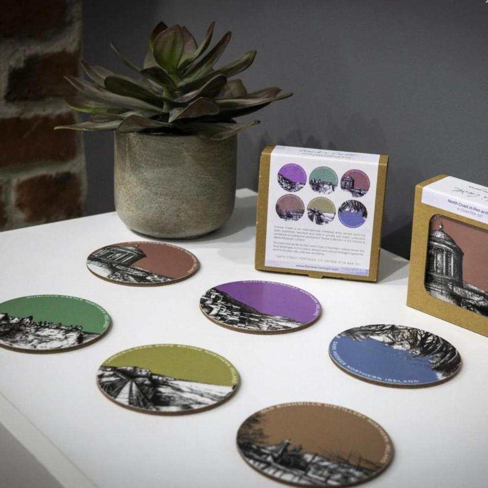 Set of six round coasters with North Coast Pen & Ink landmark prints and cork base