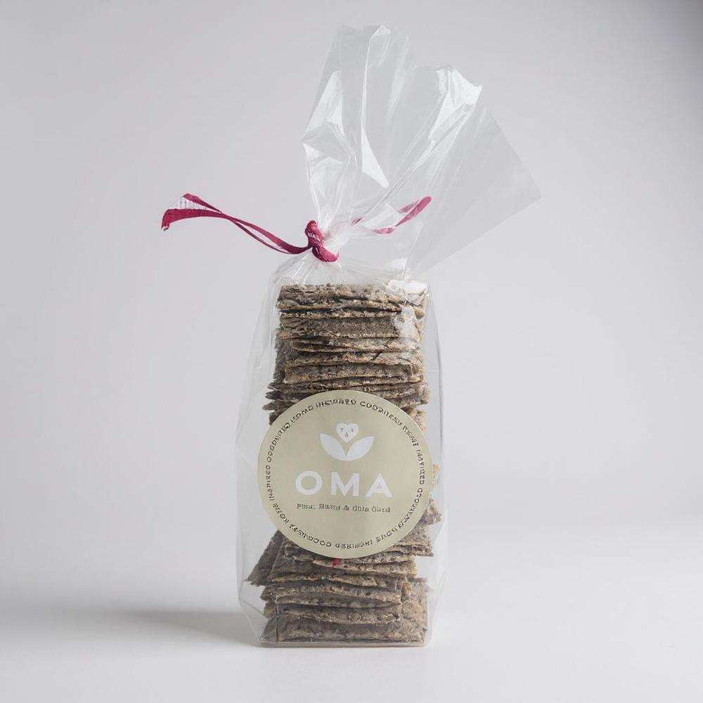 OMA crackers stack in clear packaging with a pink ribbon and OMA label displaying natural ingredients and flavors