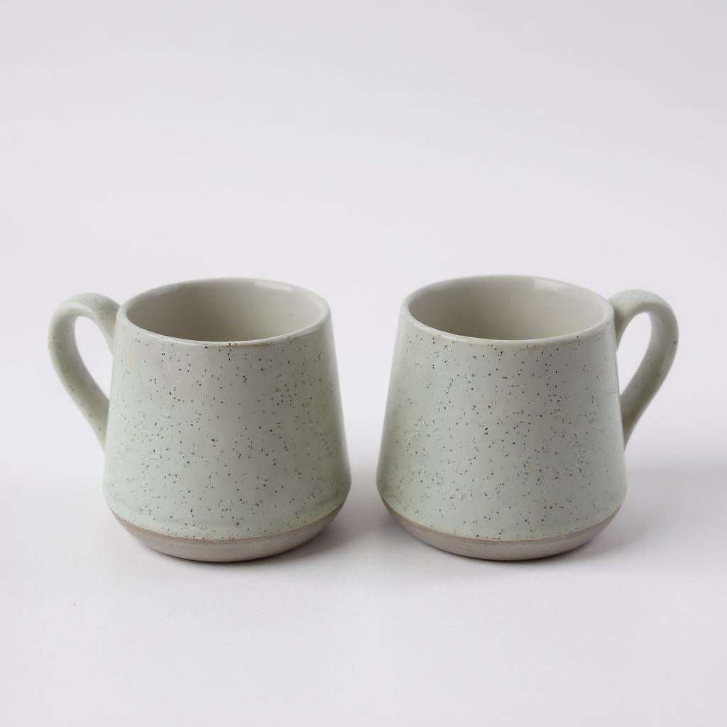 Two handmade speckled ceramic SOTG mugs perfect for coffee, tea, or hot chocolate