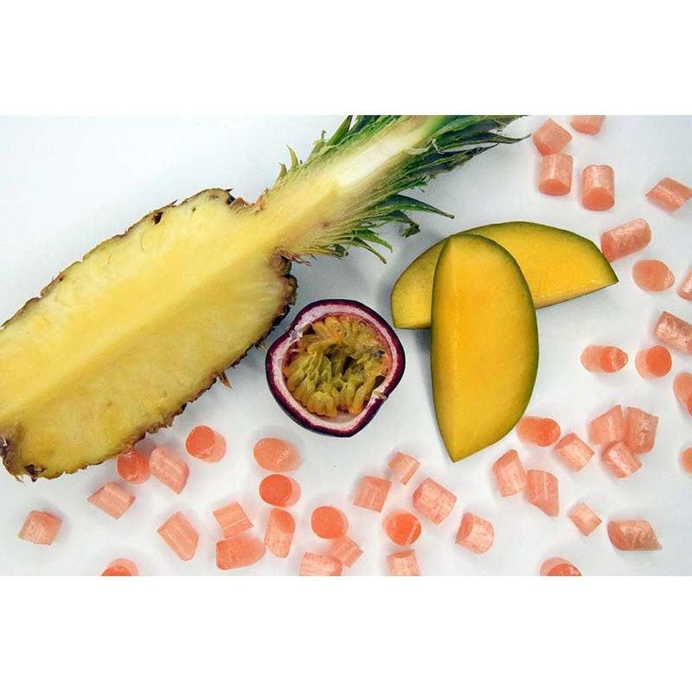 Sea Sugar Mango sweets with fresh pineapple, passion fruit, and mango slices on white background
