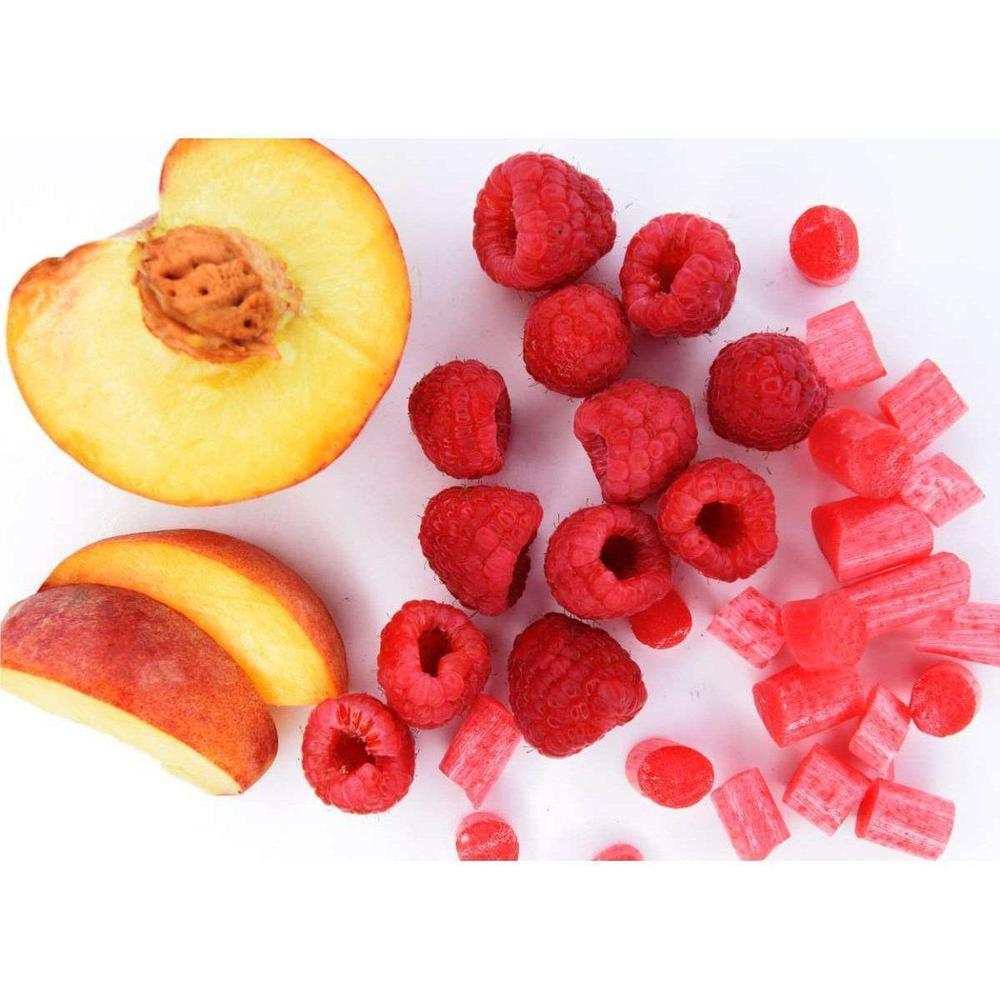 Sea Sugar Peach & Raspberry Sweets with fresh peach and raspberry pieces on white background