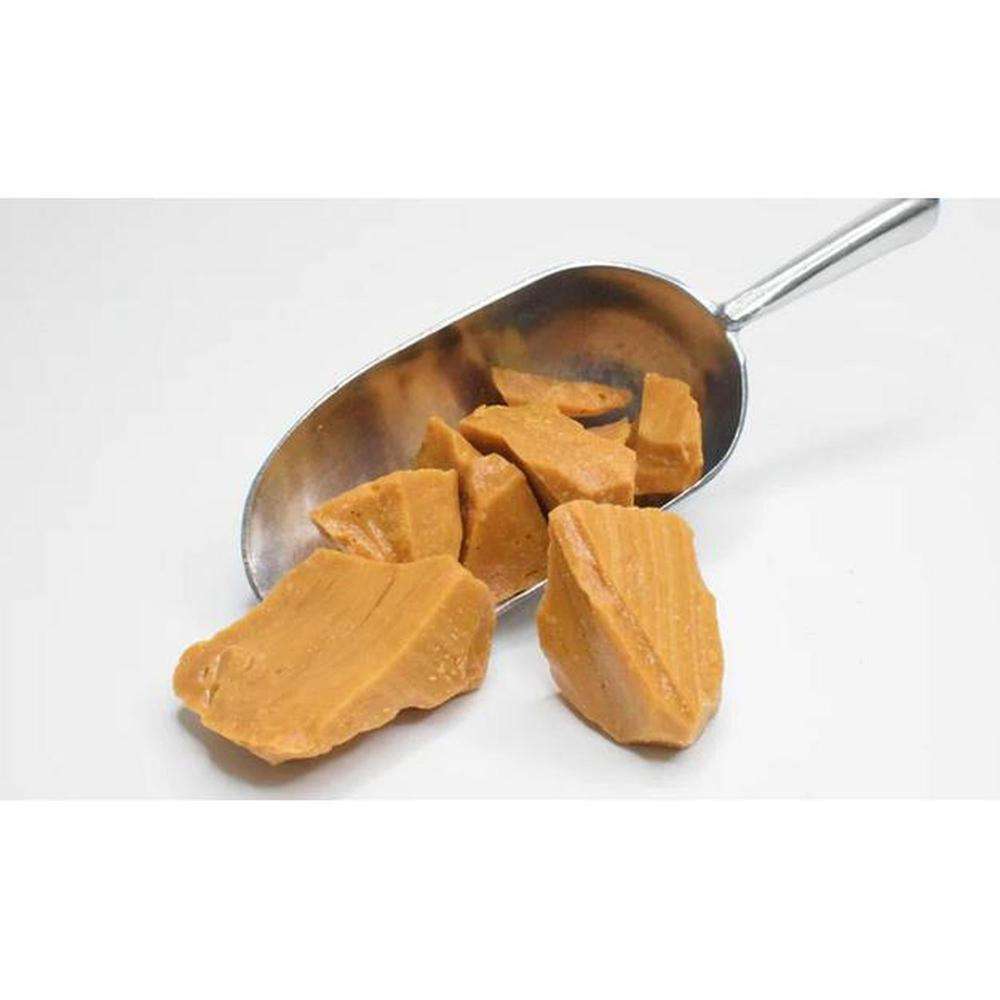 Sea Sugar Traditional Yellowman pieces on a metal scoop, hard brittle brown sugar and butter confection from County Antrim.